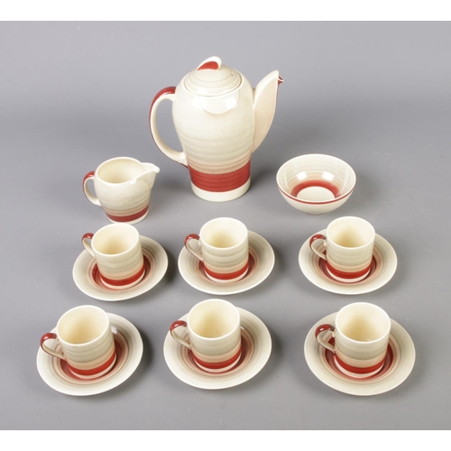 104 - A Susie Cooper art deco Kestrel shape, banded tea service to include tea pot, sugar bowl, milk jug, ... 