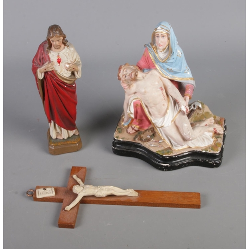 19 - Three religious figures including crucifix and Jesus in prayer.
