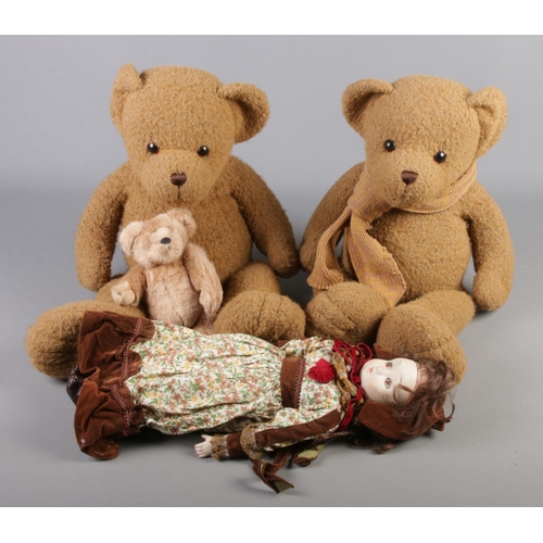 151 - A box of toys. Includes Zasan porcelain head doll, Harrods bear and two larger bears.