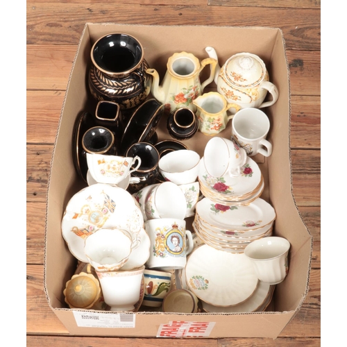 161 - A box of miscellaneous ceramics. Includes commemorative, 1911 coronation cups and saucers, Greek cer... 