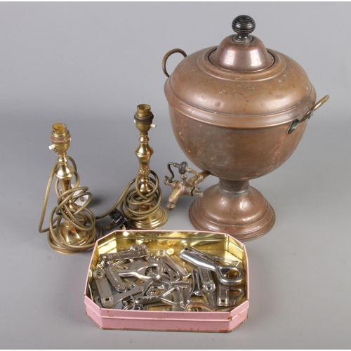 179 - A small box of metalwares. Includes copper samovar, brass candlesticks and a collection of bottle op... 