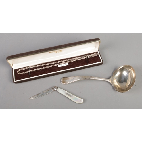 383 - A Reed & Barton sterling spoon (61g) along with a silver chain and silver bladed fruit knife.