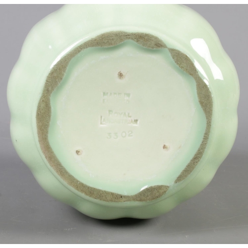 406 - A Royal Lancastrian vase shape number 3302 in pale green glaze. Approx. height 20cm.