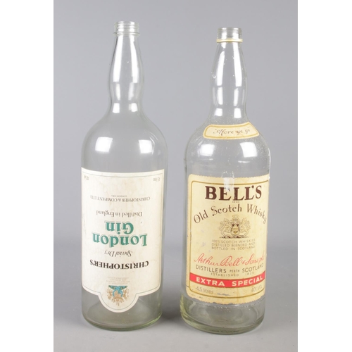 82 - Two large alcohol bottles. Includes Bell's Whisky and Christopher's London Gin.