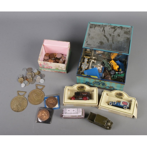 88 - A quantity of collectables including Diecast vehicles, Daffodil society medals, world coins, etc.