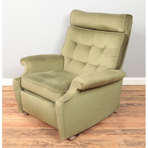 422 - A Parker Knoll Model N30 reclining arm chair.