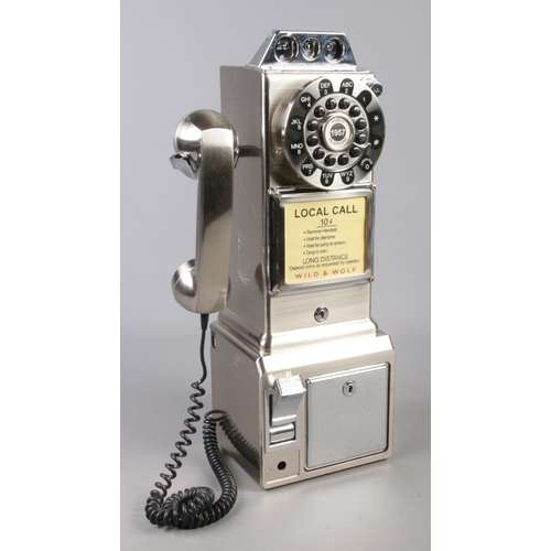 98 - A Wild & Wolf novelty telephone modelled as a payphone.