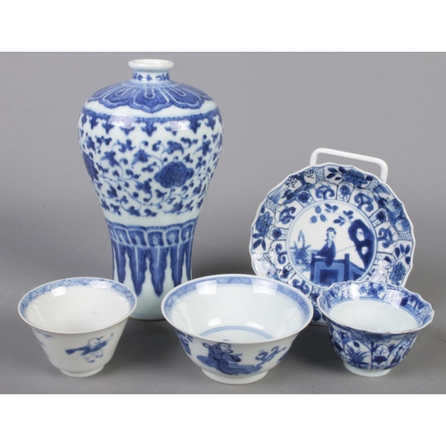 107 - A small collection of Oriental blue & white ceramics. Includes vase, dish and three bowls.