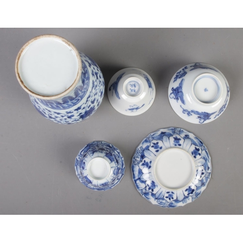 107 - A small collection of Oriental blue & white ceramics. Includes vase, dish and three bowls.