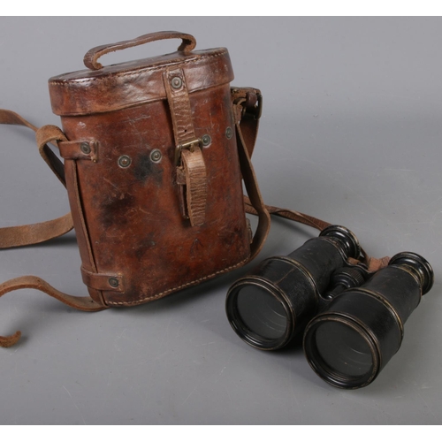 108 - A pair of WWI binoculars. Made by Lemaire Fab, Paris. Leather case baring broad arrow mark. Stamped ... 