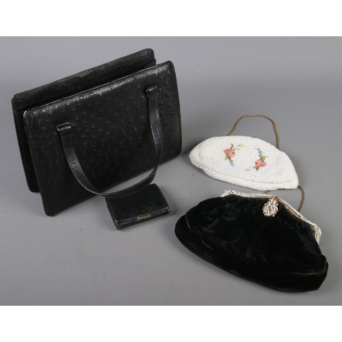 112 - A Corbeau ostrich leather handbag and purse along with two bead work bags.