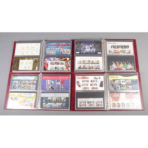 12 - Four large albums of Royal Mail presentation packs; 2007-09, 2010-12, 2012-14 and 2014-15. To includ... 