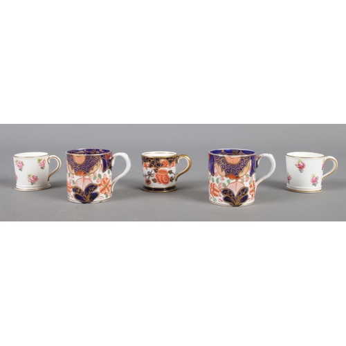 122 - Five miniature Derby and Royal Crown Derby teacups; with Royal Crown Derby examples dated 1903, 1905... 