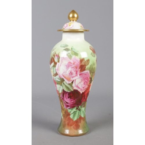 142 - A Crown Staffordshire lidded floral vase, painted by W. Hartshorne, 1915. Height: 26.5cm