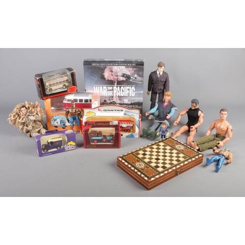 192 - A collection of assorted items, to include backgammon board, boxed diecast cars and action man figur... 