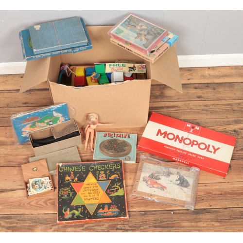 198 - A box of toys and board games. Includes Sindy Doll, Monopoly, Chinese Checkers, jigsaws, Subbuteo ac... 