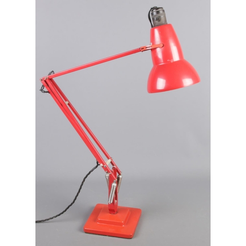 4 - A Herbert Terry red angle poise lamp.