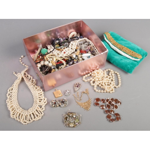 61 - A box of costume jewellery. Includes simulated pearls, bracelets, clip of earrings, pendants, chains... 