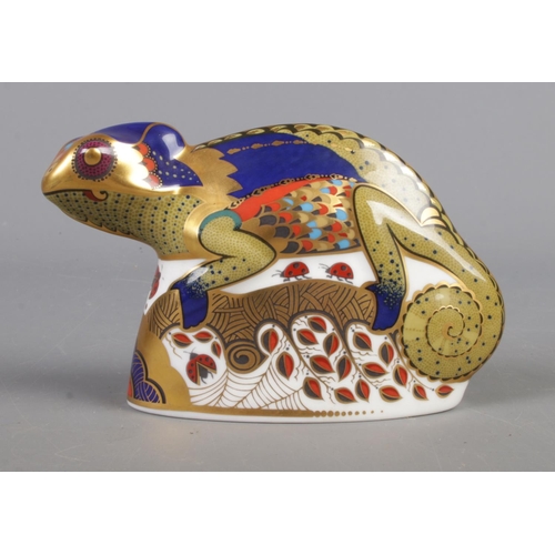 388 - A Royal Crown Derby Chameleon ceramic paperweight, with gold stopper. 9cm high.