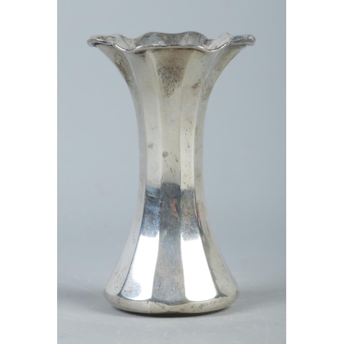 390 - A silver fluted vase. Assayed for London, 1905 by Thomas Bradbury and Sons. Marks to the base for Su... 