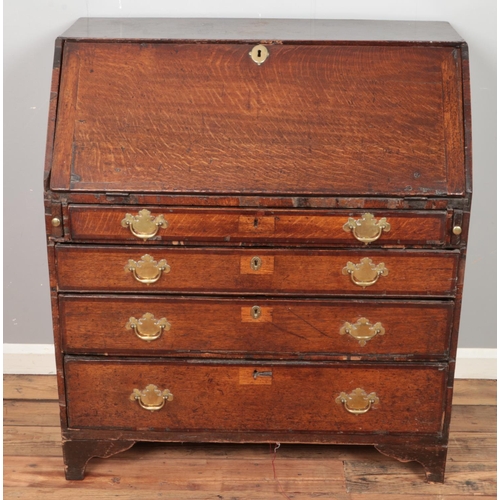 436 - A Georgian oak bureau with fitted interior. (106cm x 95cm)