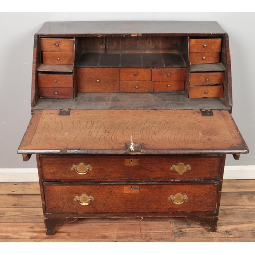 436 - A Georgian oak bureau with fitted interior. (106cm x 95cm)