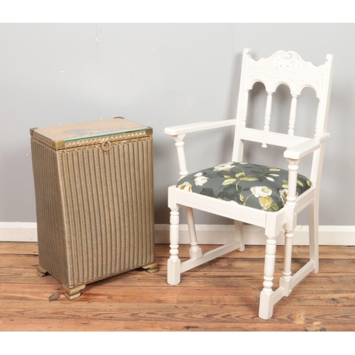 447 - A painted armchair, together with a Lloyd Loom style linen box, with embroidered top.