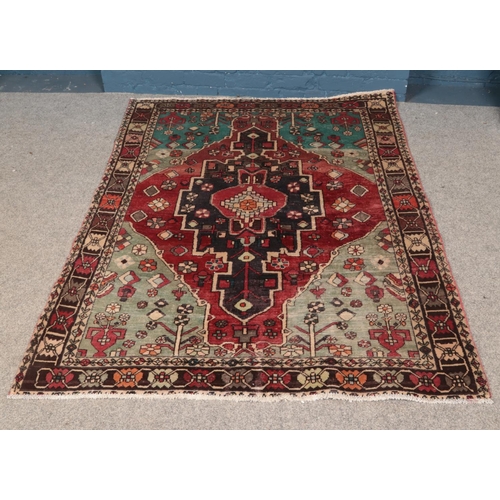 268 - A vintage Persian Herlz village rug. Approx. dimensions 194cm x 152cm.