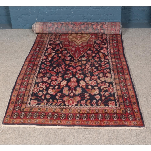 267 - A large blue ground Persian Suruk runner featuring all over floral pattern. 357cm x 127cm.