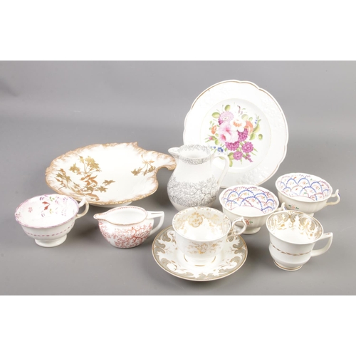 88 - A collection of mostly 19th century ceramics. Includes Rockingham style cup and saucer, seaweed patt... 