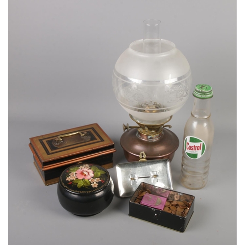 23 - A vintage Castrol pint bottle along with two metal cash boxes/tins, an oil lamp and a barge ware pot... 