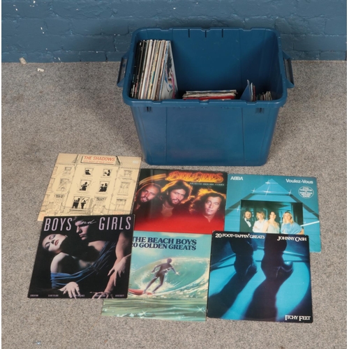 217 - A quantity of records and singles of mainly pop to include Madonna, Abba, Bee Jees, etc.