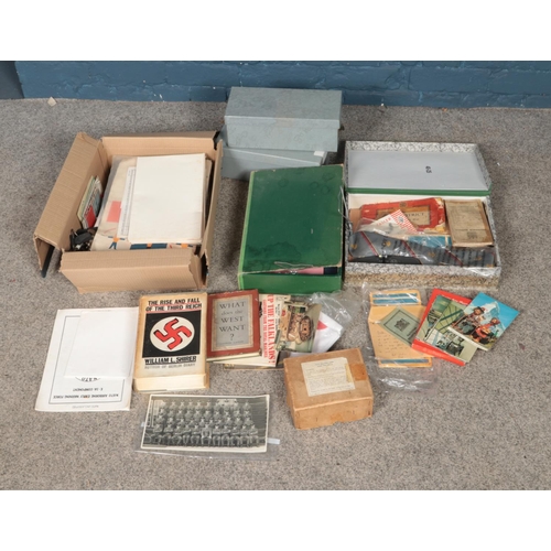 226 - A collection of books and ephemera to include military examples, postcards, ordinance surveys, etc.