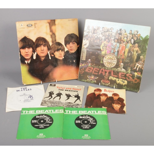 36 - A small quantity of Beatles records. Includes Sgt Pepper LP, Twist and Shout single, etc.