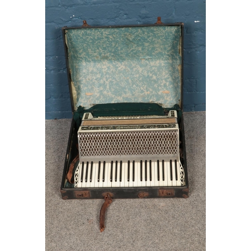 258 - A cased Hohner Verdi III accordian.