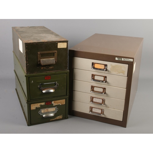 260 - Four metal filing drawers. Includes two Veteran Series military green coloured single drawer example... 