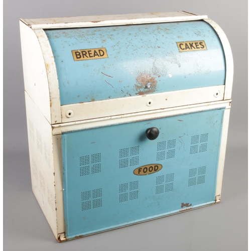 275 - A retro enamel bread bin with rolling top. (48cm x 46cm)