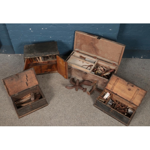 281 - Four vintage crates containing a good assortment of tools. Includes spanners hammers, drill bits and... 