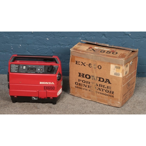 291 - A boxed Honda EX650 generator.