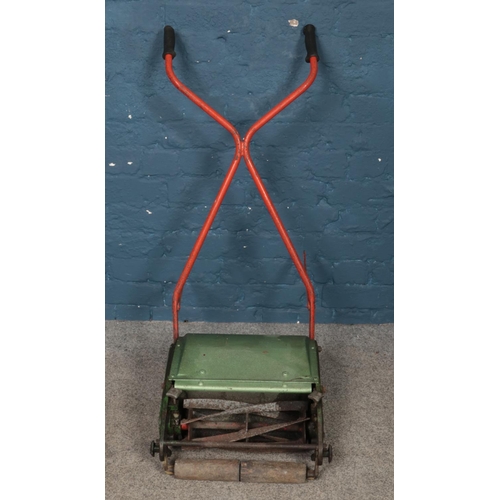 298 - A vintage lawnmower.