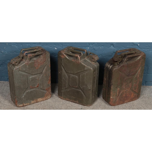 307 - Three metal Jerry cans.