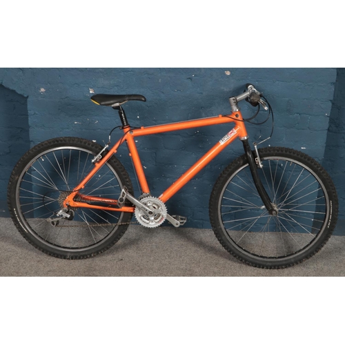 312 - An orange Rock Shox racing bike.