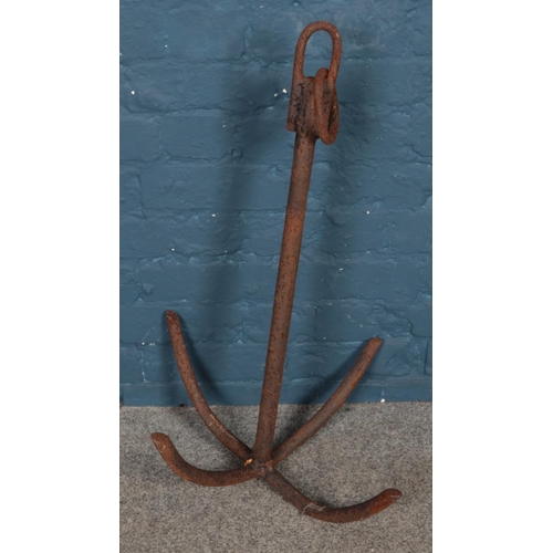 313 - A cast iron boats anchor.