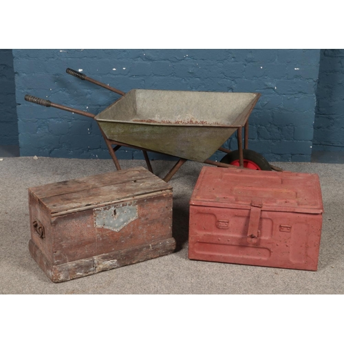 315 - A galvanised metal wheelbarrow, together with a tin trunk dated 1944 and hinged wooden box.