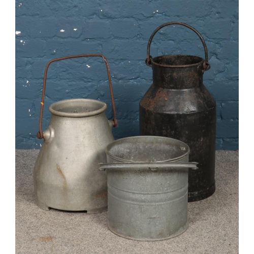 316 - Two metal milk churns, labelled for Gascoignes and WN Frefborough, Melton Mobray, together with a ga... 