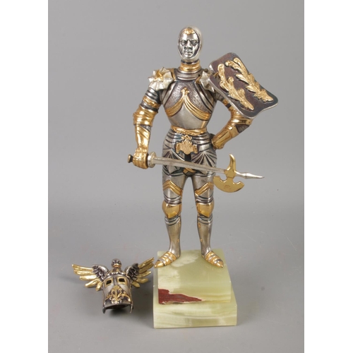 67 - A Gippe Vasani style figure of a medieval knight with removable helmet. Approx. 27cm tall. Stamped 1... 