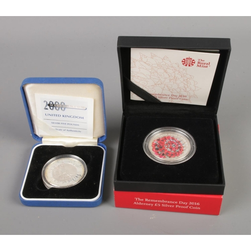 374 - Two silver proof five pound commemorative coins including Royal Mint Remembrance Day 2016 Alderney a... 