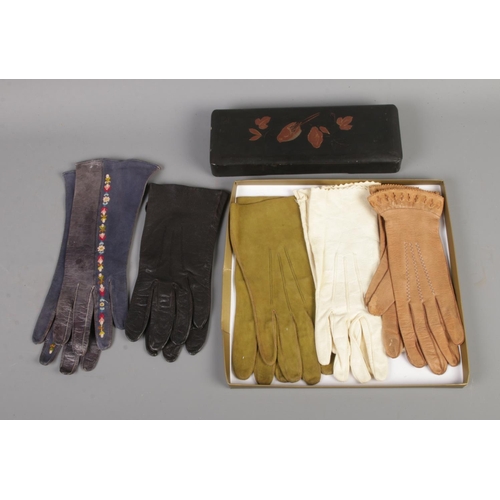 69 - Five pairs of vintage leather gloves along with oriental style glove box.