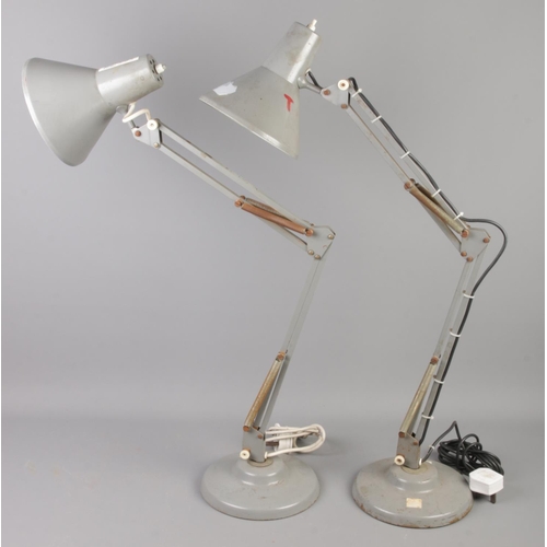 72 - A pair of Thousand & One Ltd anglepoise desk lamps.