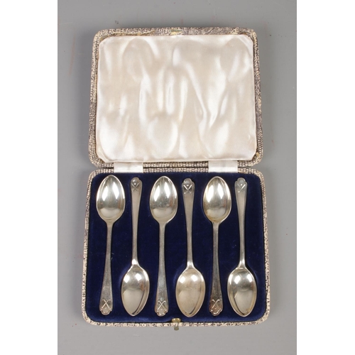 375 - A cased set of silver Walker & Hall tea spoons featuring golfing decoration to handle. Assayed Chest... 